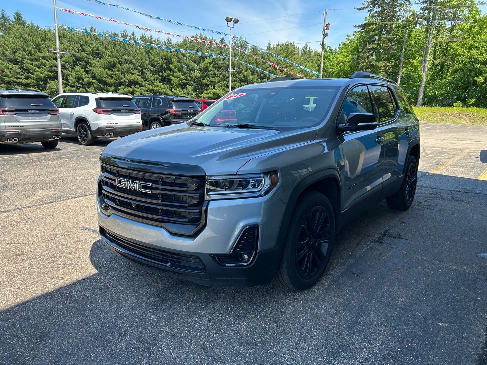 2023 GMC Acadia SLT in Sterling Metallic — front three-quarter view