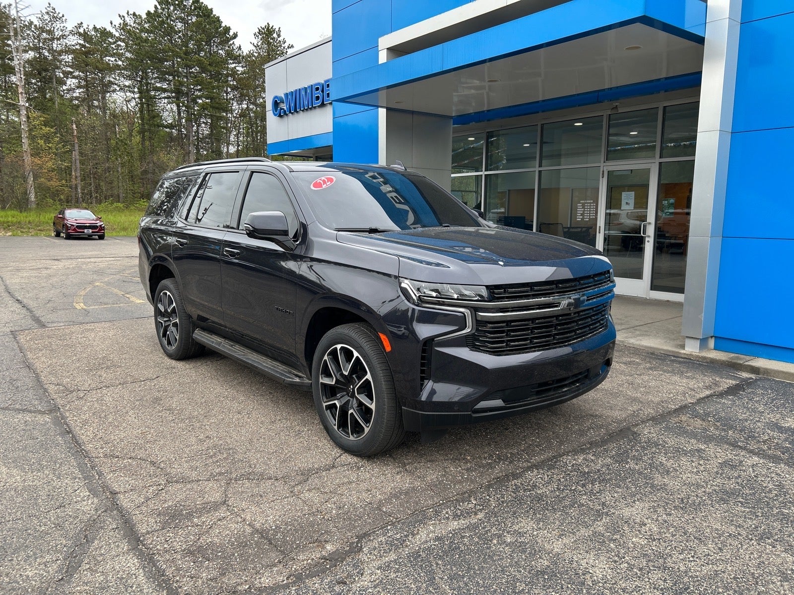2022 Chevrolet Tahoe RST in Dark Ash Metallic — front three-quarter view
