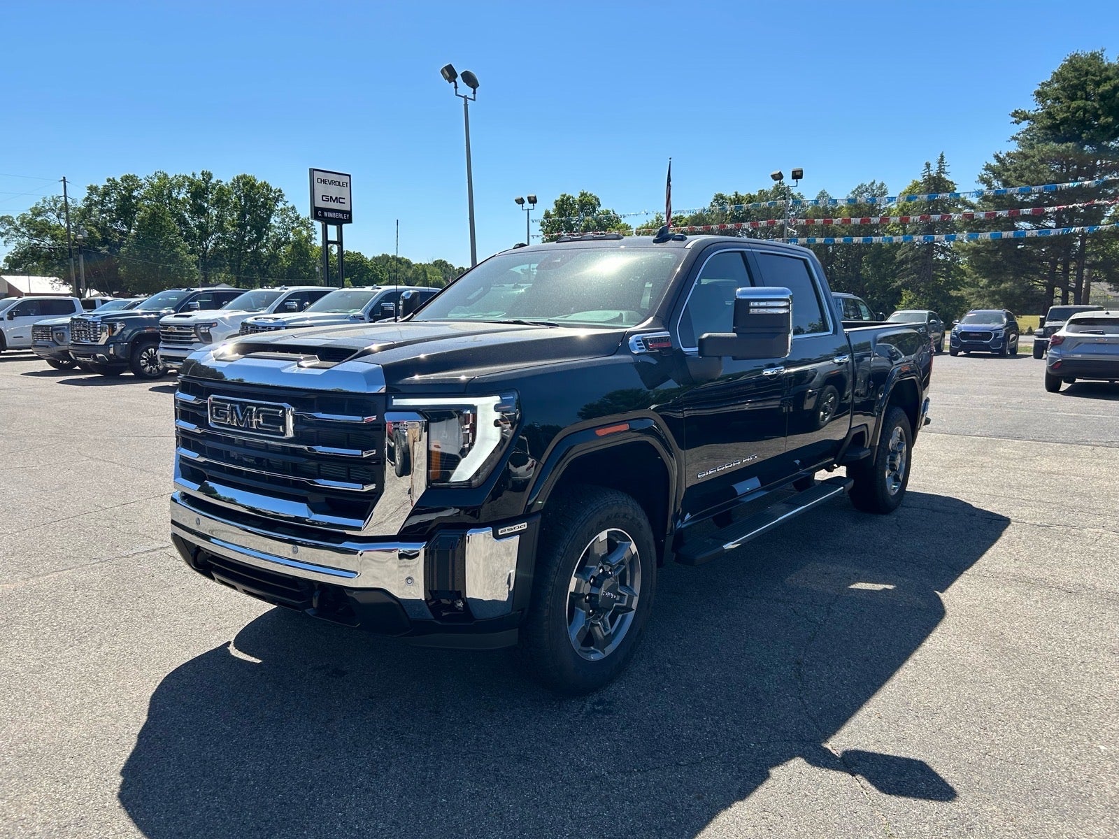 2026 GMC Sierra 2500 HD SLT in Onyx Black — front three-quarter view