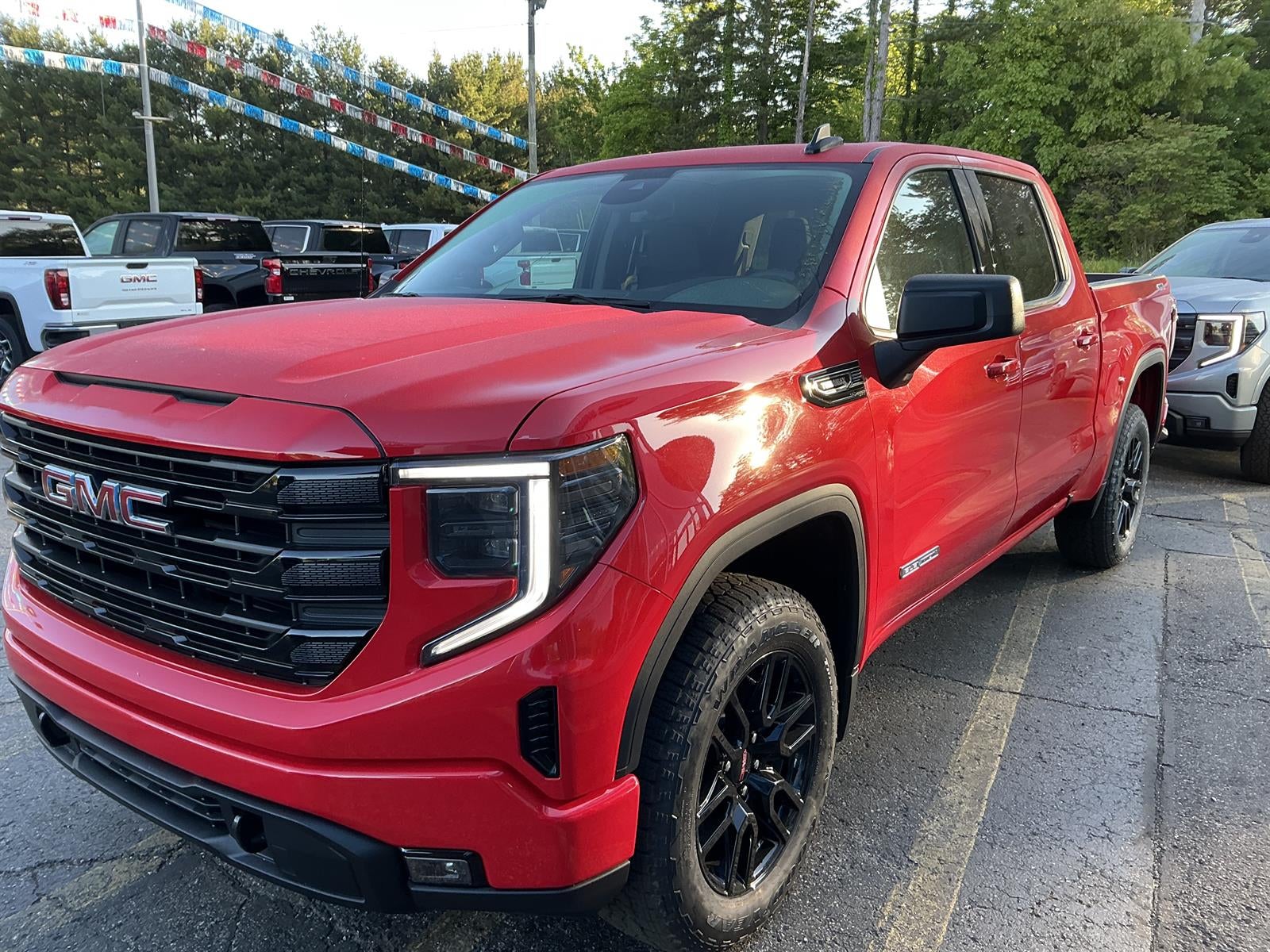 2026 GMC Sierra 1500 Elevation in Cardinal Red — front three-quarter view