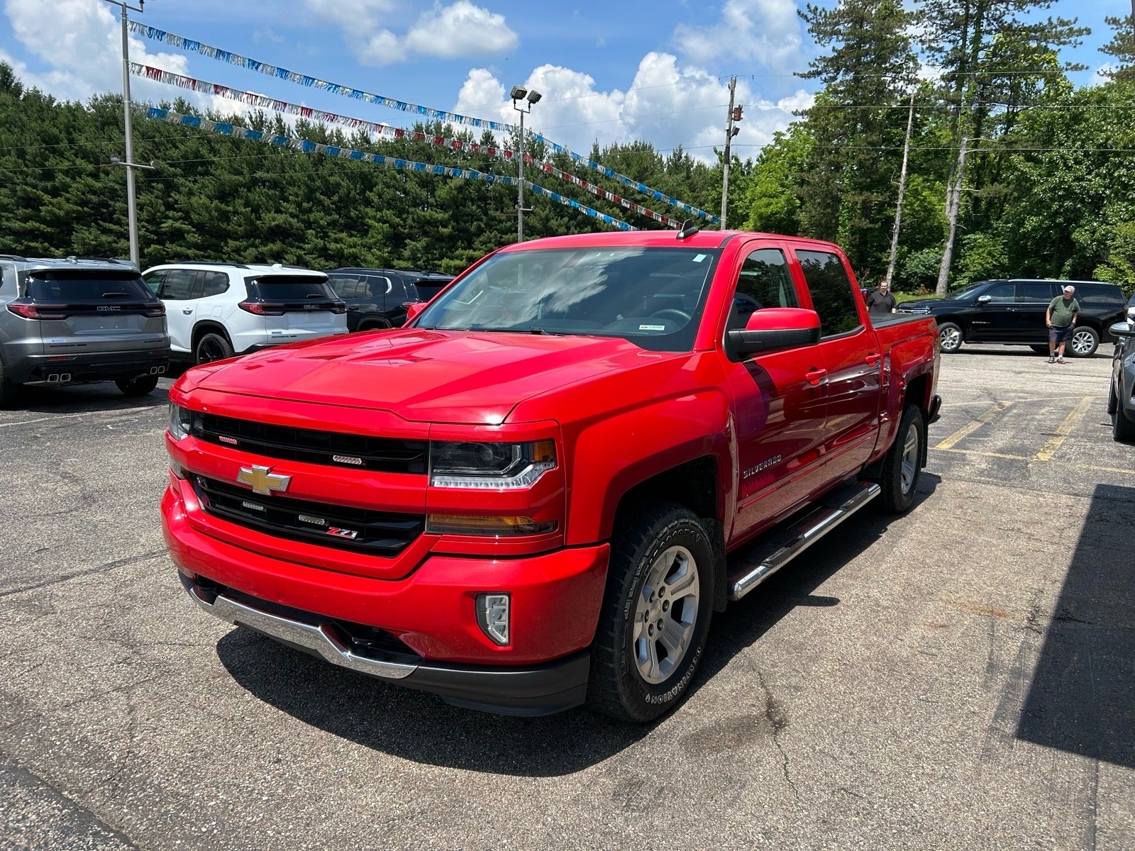 2017 Chevrolet Silverado 1500 LT in Red Hot — front three-quarter view
