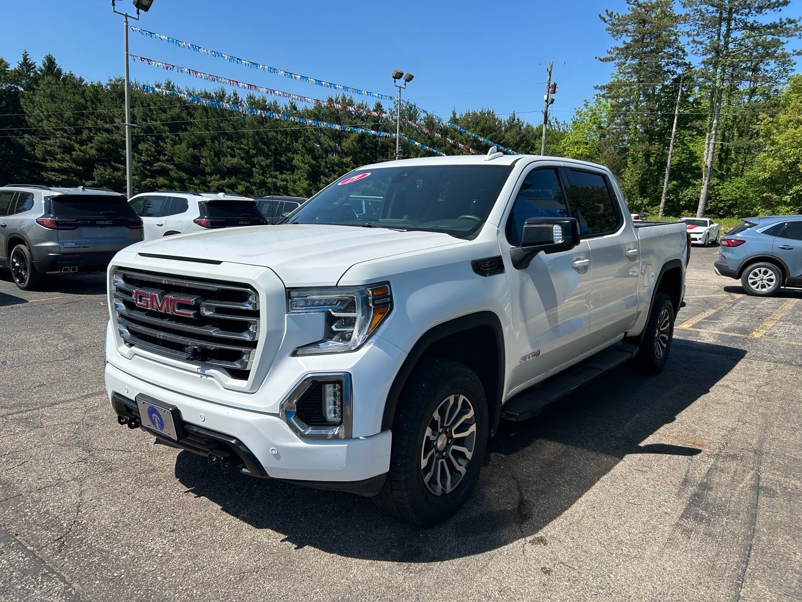 2019 GMC Sierra 1500 AT4 in Summit White — front three-quarter view
