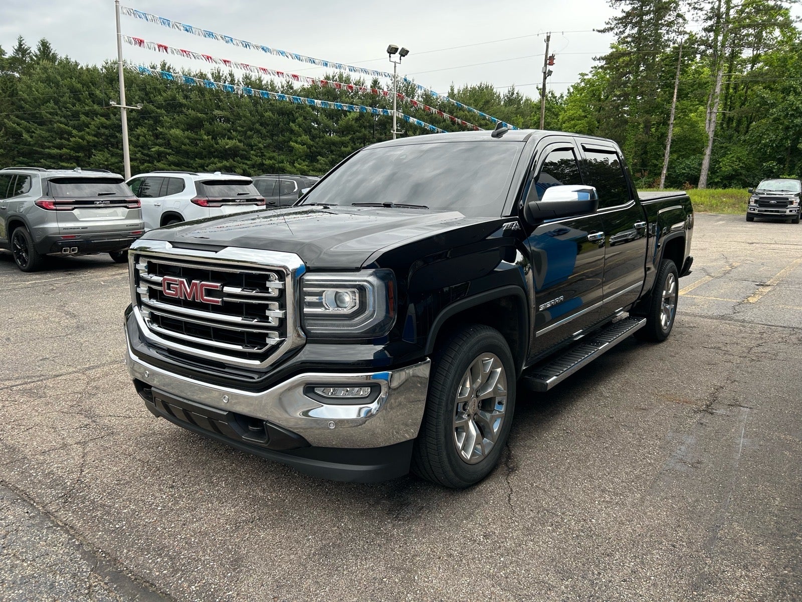 2018 GMC Sierra 1500 SLT in Onyx Black — front three-quarter view