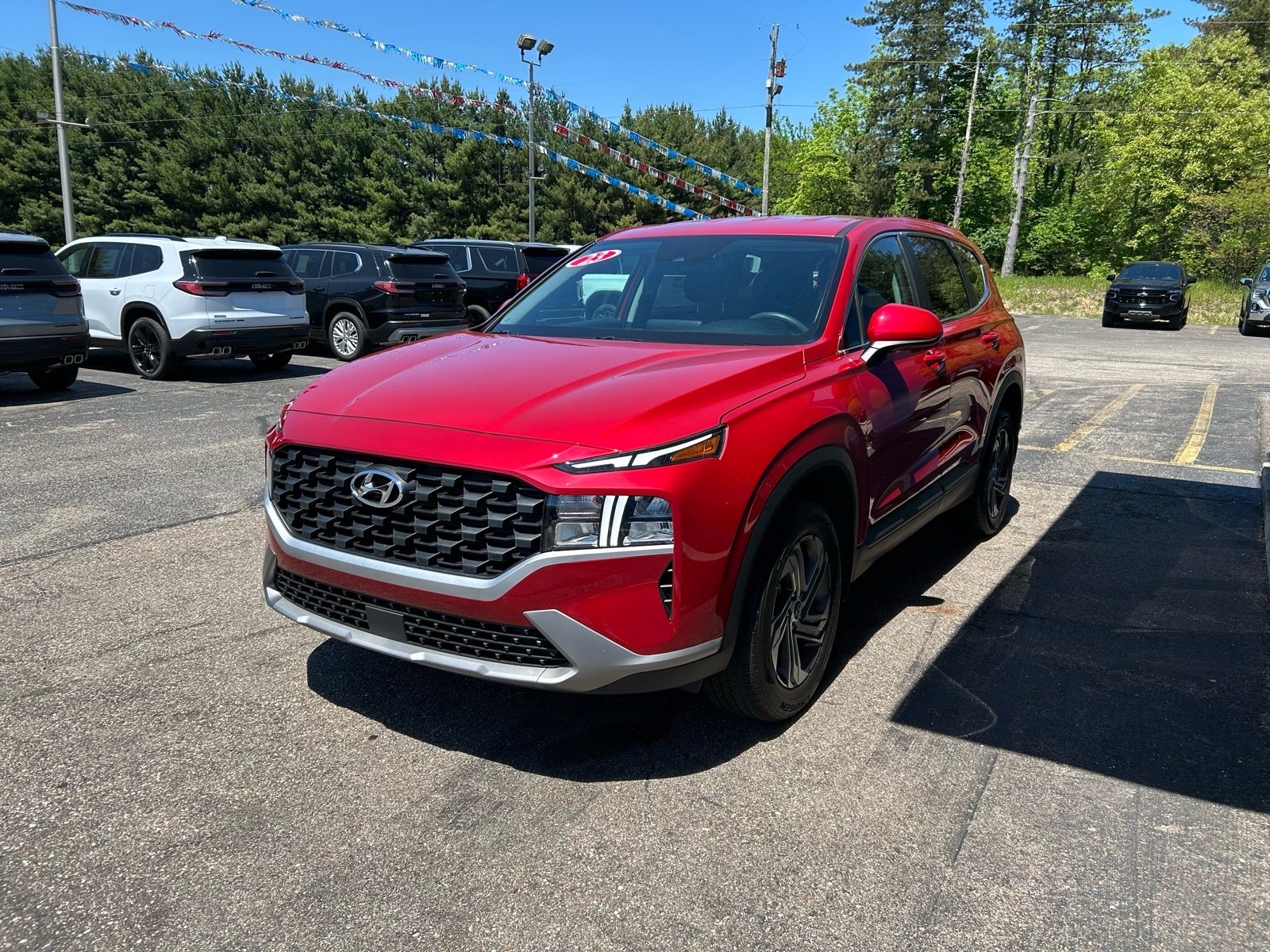 2023 Hyundai Santa Fe SE in Red — front three-quarter view