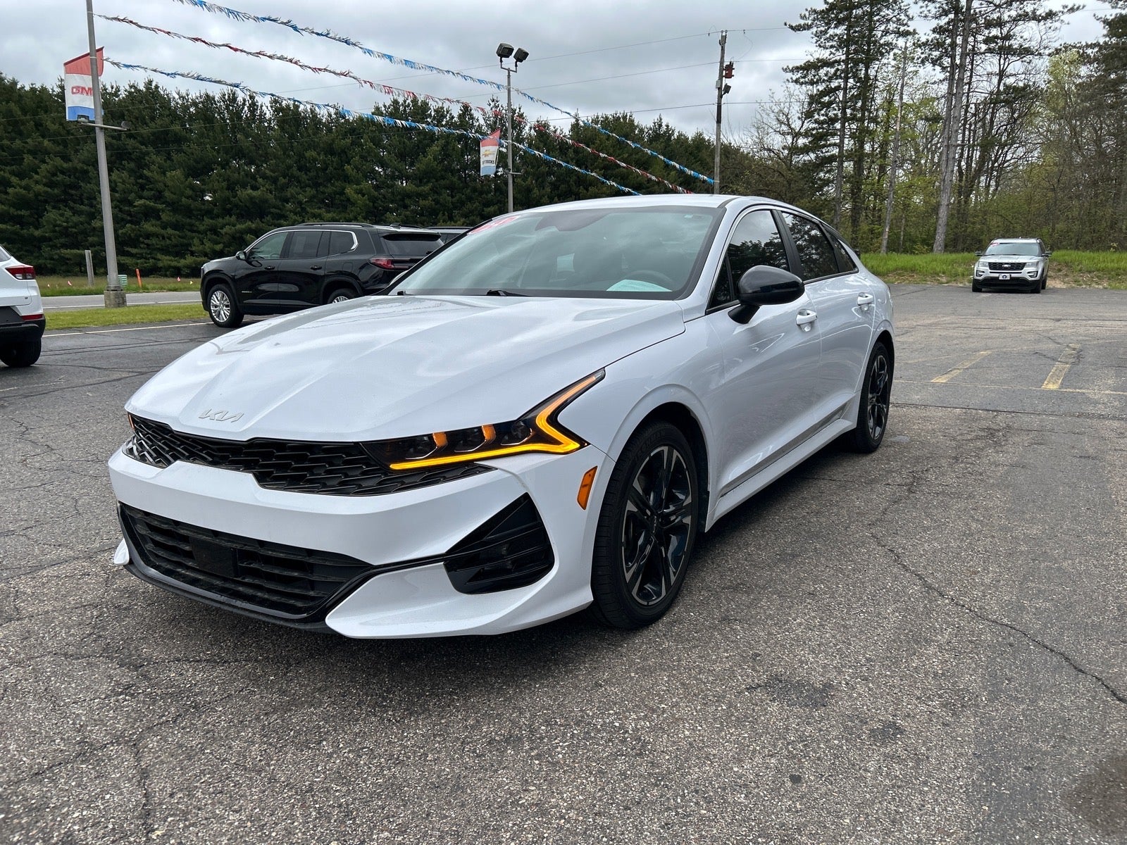 2024 Kia K5 GT-Line in White — front three-quarter view